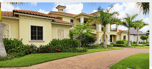 Spanish style home with mature landscaping